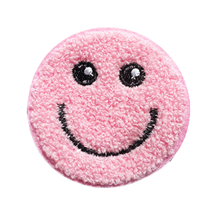 Pink smiley face patch with black details on a white background